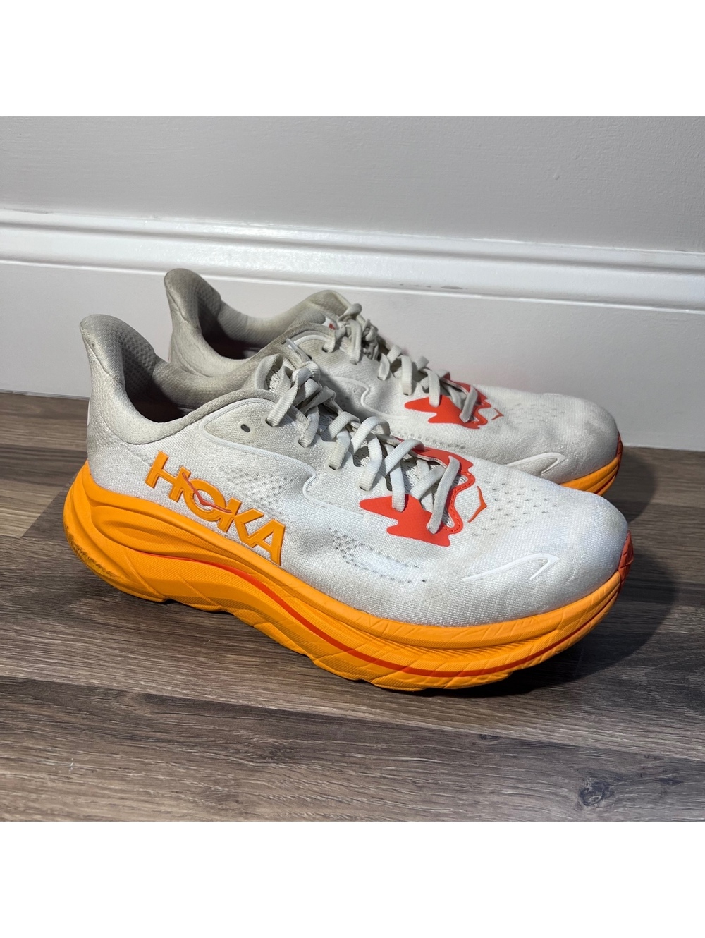 Hoka One One white and orange running shoes women's size 9.5